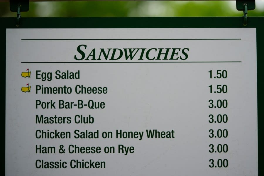 The prices for sandwiches are posted on a sign during a practice round in preparation for the Masters golf tournament at Augusta National Golf Club Tuesday, April 9, 2024, in Augusta, Ga. (AP Photo/Matt Slocum)