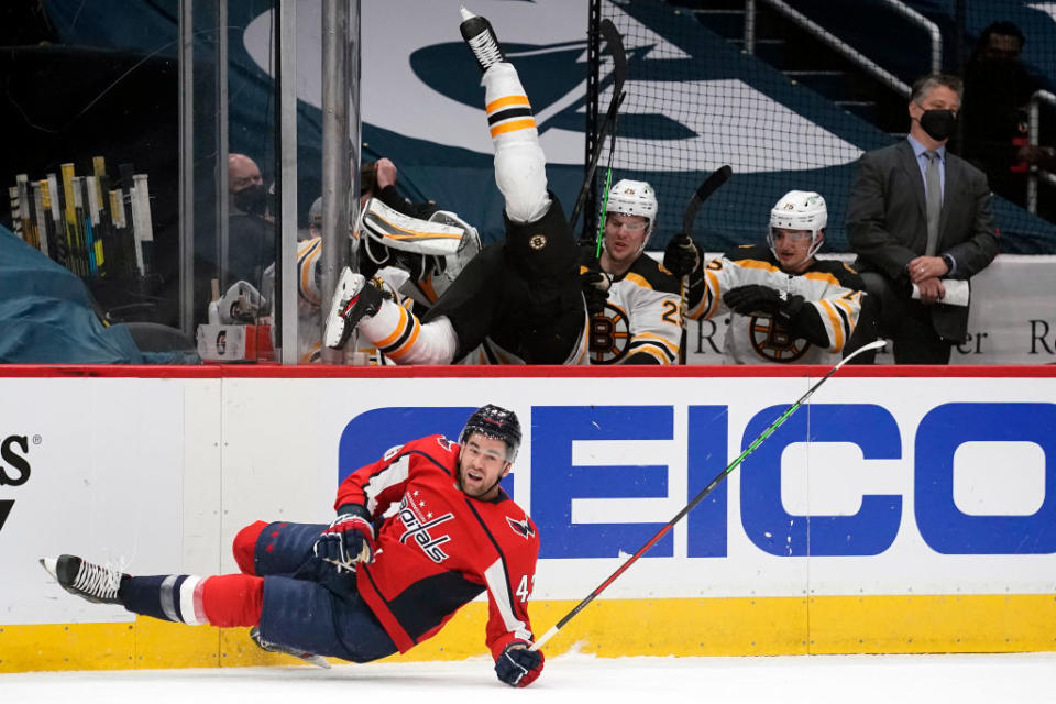 Tom Wilson sent Curtis Lazar flying into the Bruins bench with a monster hit in Game 2. (Getty Images)