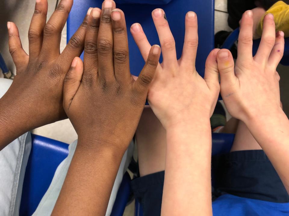 Pre-Kindergarten students at Kids Academy Learning Center USA in Haines City watched Vice Mayor Horace West perform a magic trick.  His brother, Mayor Morris West, read the book "Martin Luther King, Jr., Day" to students and talked with them about their dreams.