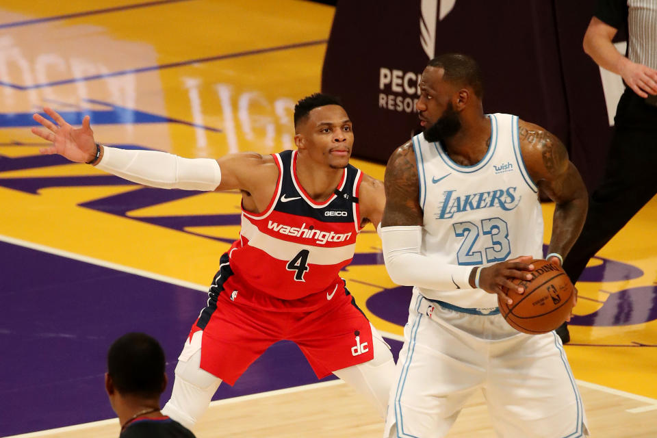 Russell Westbrook guards LeBron James.