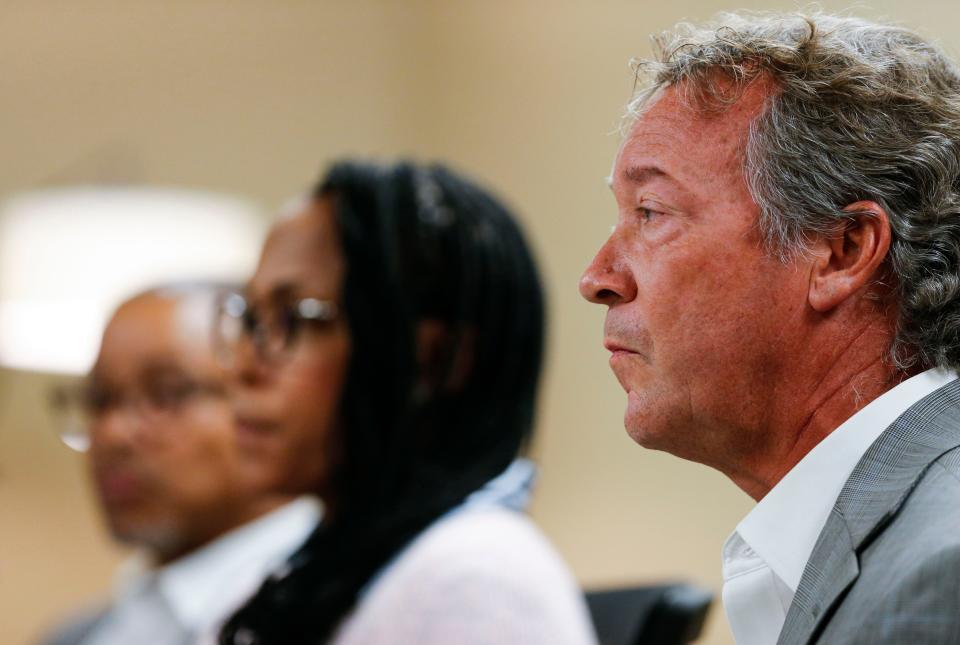 Attorney Jay Kirksey with his clients Darline and Sean Mabins make a statement ahead of a Springfield Public School Board meeting where Darline intends to speak about Policy AC, the school district's staff and student harassment policy, on Tuesday, Sept. 26, 2023.