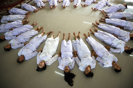 Thai women devotees attend an icebreaking session ahead of their ordination to be novice monks at the Songdhammakalyani monastery, Nakhon Pathom province, Thailand, December 3, 2018. REUTERS/Athit Perawongmetha