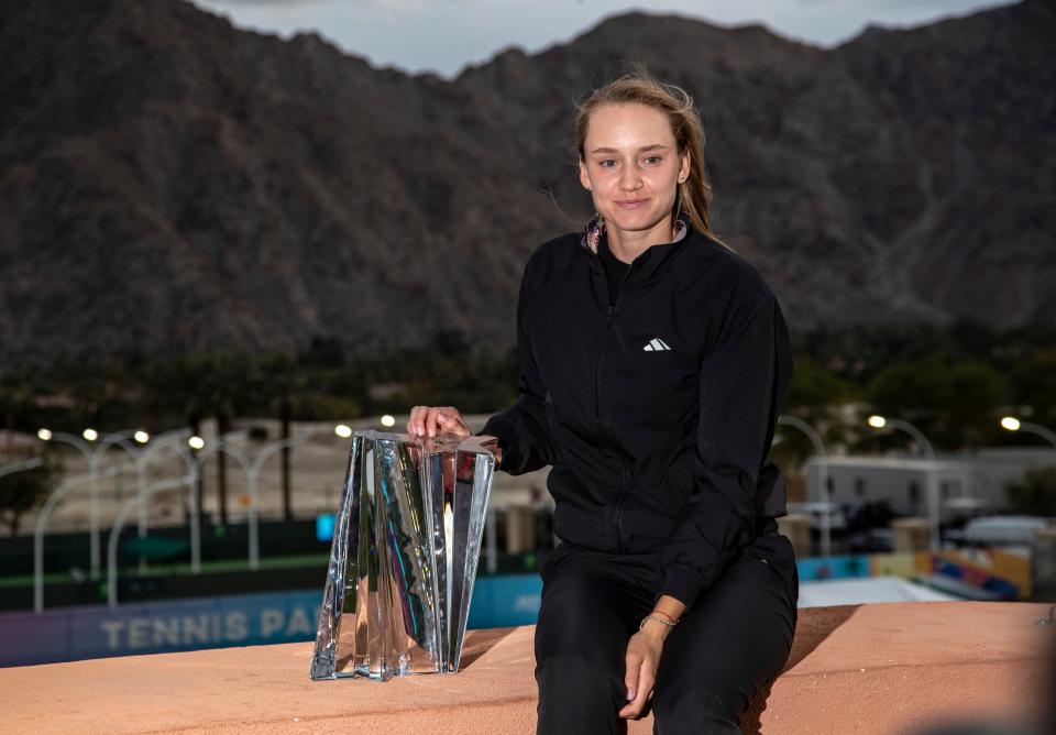 2023 women's singles champion Elena Rybakina of Kazakhstan poses for a photo with the trophy after winning at the BNP Paribas Open at the Indian Wells Tennis Garden in Indian Wells, Calif., Sunday, March 19, 2023.