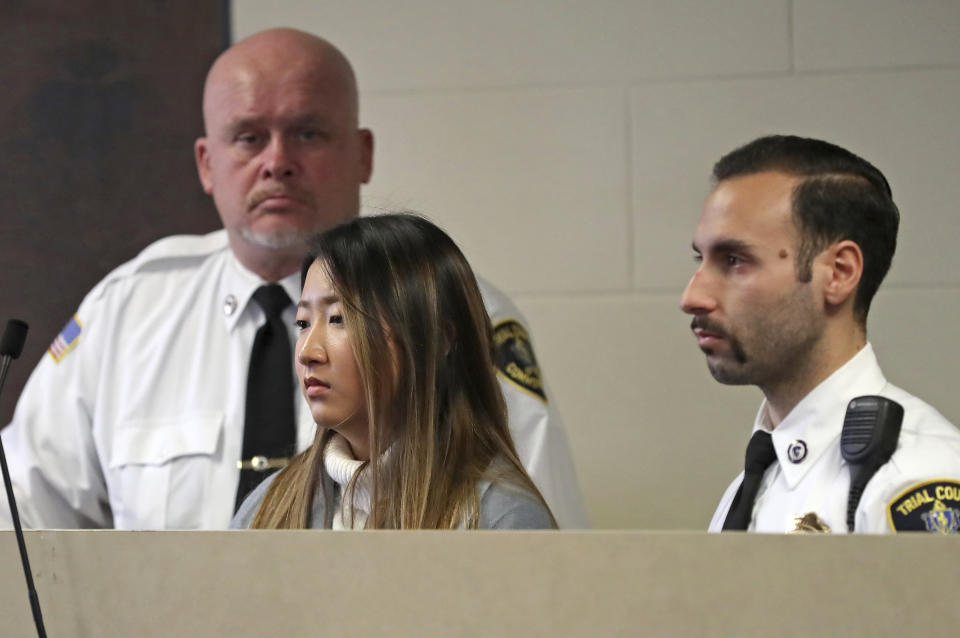 Inyoung You, 21, appears in Suffolk Superior Court, Friday, Nov. 22, 2019, in Boston. The former Boston College student pleaded not guilty to involuntary manslaughter in a case accusing her of encouraging her boyfriend Alexander Urtula to take his life. Prosecutors say she sent Urtula more than 47,000 text messages in the last two months of the relationship, including many urging him to “go kill yourself.” (David L Ryan/The Boston Globe via AP, Pool)