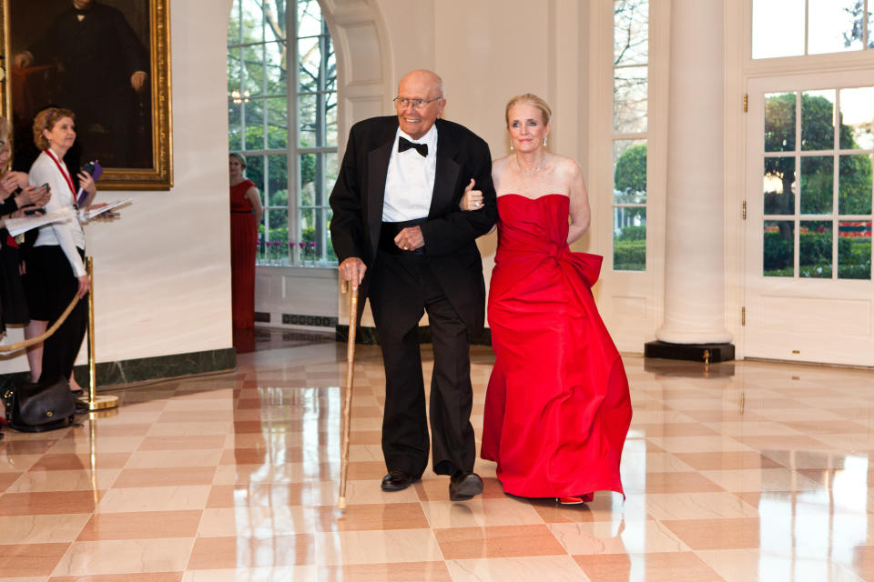 Dingell and his wife arrive for a state dinner in honor of British Prime Minister David Cameron at the White House on March 14, 2012.