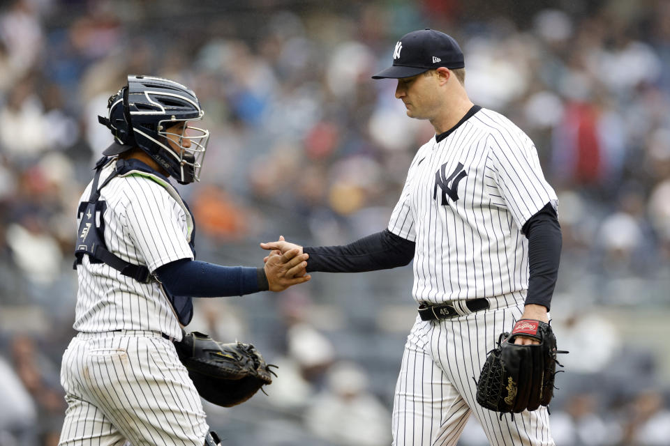 NEW YORK, NEW YORK - APRIL 05: Jose Trevino #39 reacts with Gerrit Cole #45 of the New York Yankees after coming out of the game during the seventh inning against the Philadelphia Phillies at Yankee Stadium on April 05, 2023 in the Bronx borough of New York City. (Photo by Sarah Stier/Getty Images)