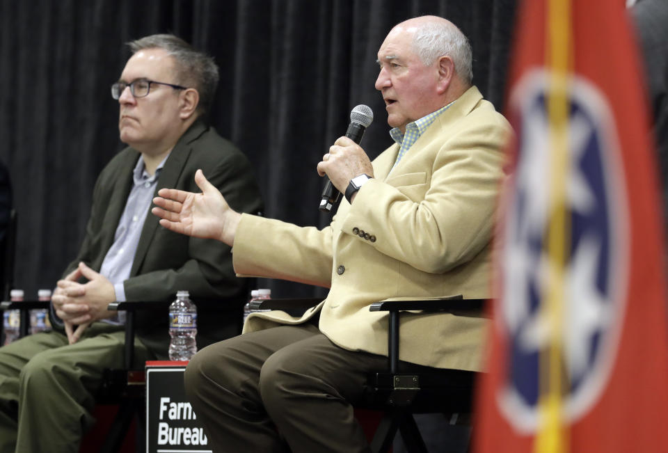 Agriculture Secretary Sonny Perdue, right, and Acting EPA administrator Andrew Wheeler answer questions Tuesday, Dec. 18, 2018, in Lebanon, Tenn. The two met with farmers about a new Trump administration proposal to redefine "waters of the United States." (AP Photo/Mark Humphrey)