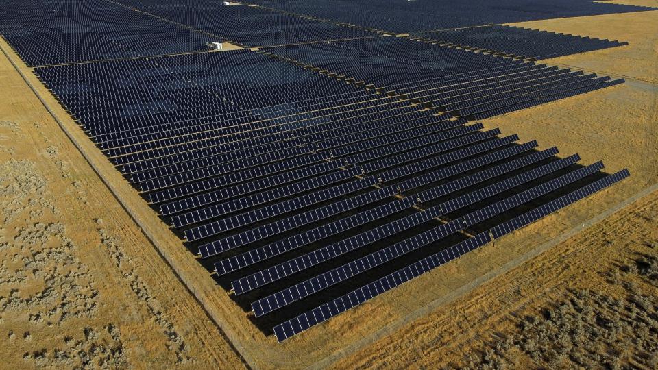 FILE - A solar farm sits in Mona, Utah, Aug. 9, 2022. On Tuesday, Feb. 27, 2024, the Biden administration will announce 17 projects across the U.S. to expand renewable energy access in rural areas, particularly for Native American tribes. The projects, which will cost $366 million, are funded by a $1 trillion infrastructure law President Joe Biden signed in 2021. (AP Photo/Rick Bowmer, File)