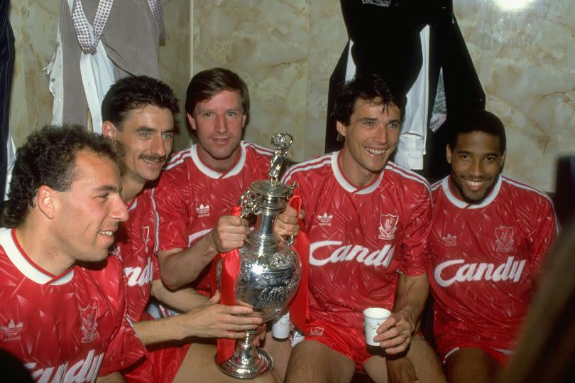 Alan Hansen celebrates winning Division One in 1990 with Liverpool teammates Ronnie Rosenthal, Ian Rush, Ronnie Whelan and John Barnes