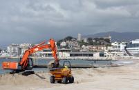 Construction machineries are seen in action on the beach of the Croisette in Cannes