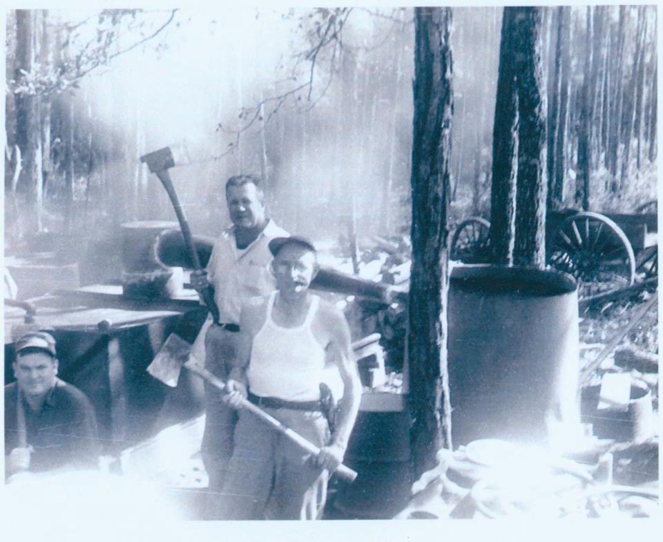 As this undated photo from Clay County shows, this is how you destroy a moonshine still.