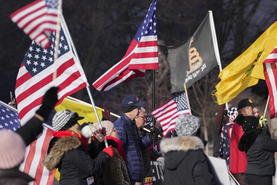 Sat., Jan. 8, 2022; Columbus, Ohio, USA; People listen during the "Maximum Freedom" Rally at the Ohio Statehouse. Several groups rallied at the Statehouse against vaccine mandates as a response to the ongoing COVID-19 pandemic.