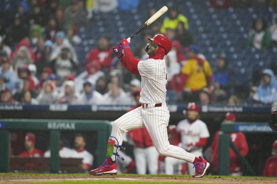 PHILADELPHIA, PENNSYLVANIA - APRIL 2: Bryce Harper #3 of the Philadelphia Phillies hits a solo home run in the bottom of the first inning against the Cincinnati Reds at Citizens Bank Park on April 2, 2024 in Philadelphia, Pennsylvania. (Photo by Mitchell Leff/Getty Images)