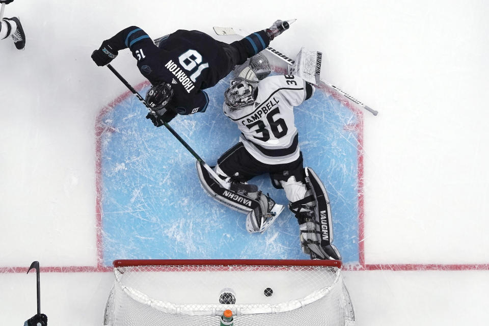 San Jose Sharks center Joe Thornton (19) scores a goal past Los Angeles Kings goaltender Jack Campbell (36) during the second period of an NHL hockey game in San Jose, Calif., Friday, Dec. 27, 2019. (AP Photo/Tony Avelar)