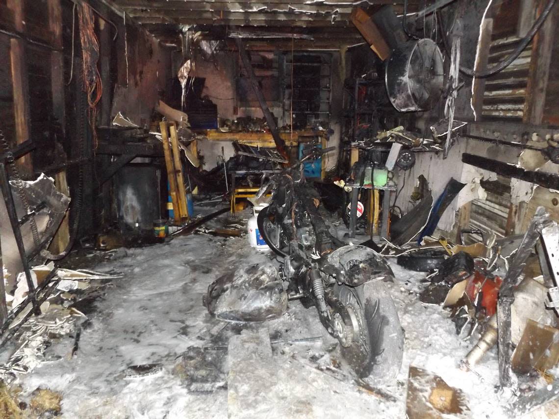 The aftermath of a garage fire in Russell that sent fire chief Dylan Riedel to the hospital after a gas tank exploded.