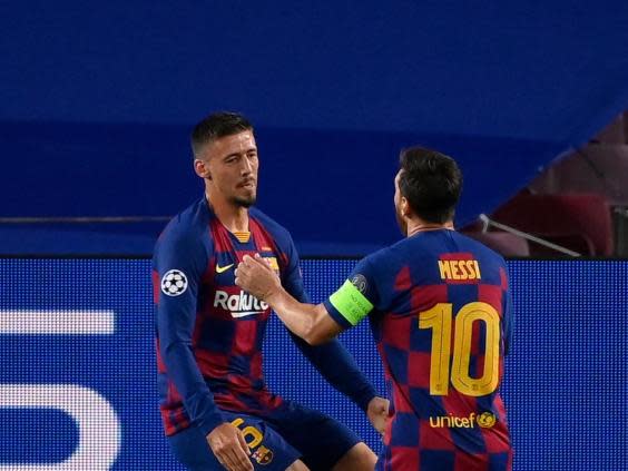 Lenglet celebrates with Messi after putting Barcelona ahead (AFP)