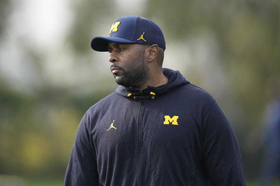Michigan offensive coordinator Sherrone Moore walks during NCAA college football practice Friday, Dec. 29, 2023, in Carson, Calif. Michigan is scheduled to play against Alabama on New Year's Day in the Rose Bowl, a semifinal in the College Football Playoff. (AP Photo/Ryan Sun)