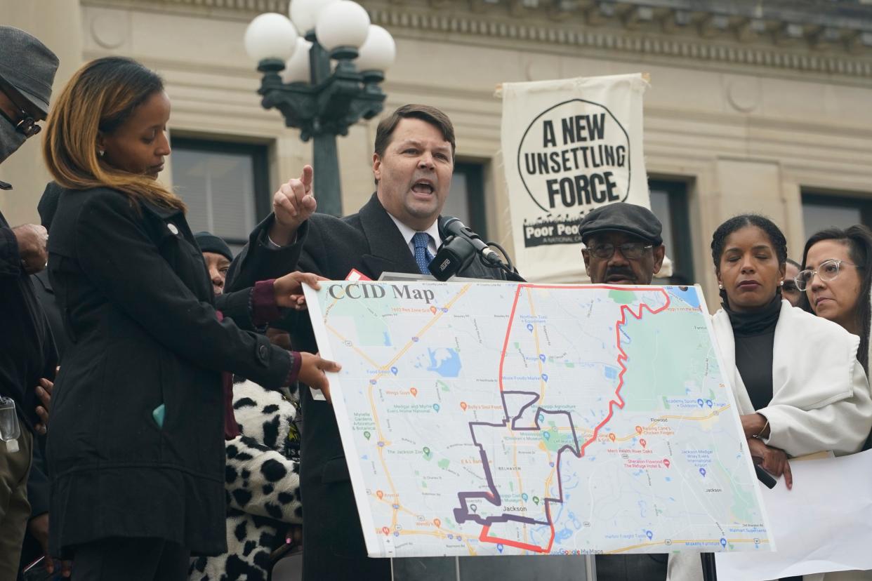 Cliff Johnson, center, with the MacArthur Justice Center, voices his opposition to Mississippi House Bill 1020, Tuesday, Jan. 31, 2023, during a protest at the Mississippi Capitol in Jackson. The bill would create a separate court system in the Capitol Complex Improvement District in Jackson.