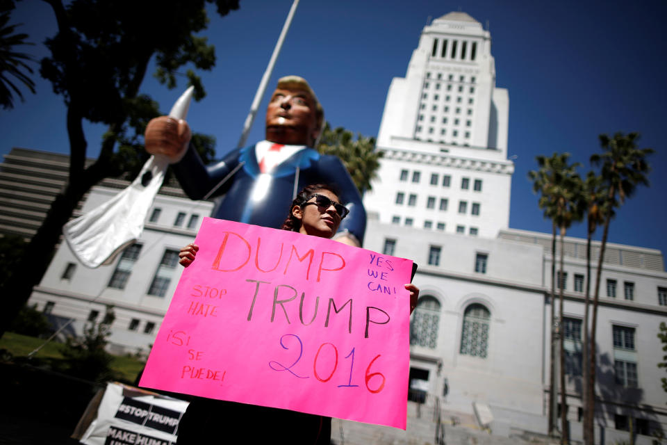 Dump Trump: A protester holds an effigy of Donald Trump at an immigrant rights May Day march in Los Angeles, Calif. (Photo: Lucy Nicholson/Reuters)