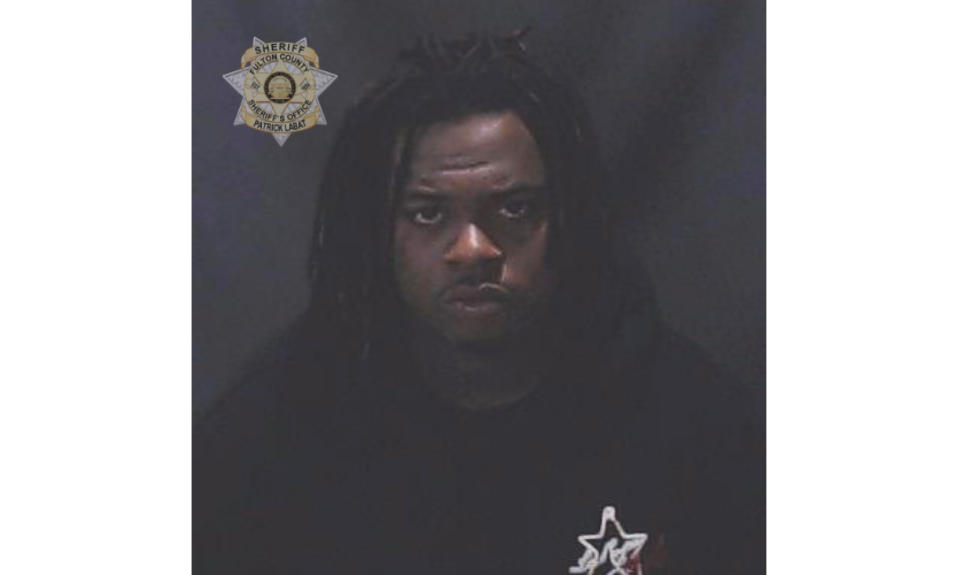 This image provided by the Fulton County Sheriff's Office shows rapper Gunna, whose given name is Sergio Kitchens. Rapper Gunna was booked into a jail in Atlanta Wednesday, May 11, 2022 on a racketeering charge after he was indicted with fellow rapper Young Thug and more than two dozen other people. An indictment filed Monday in Fulton County Superior Court accuses him of violating Georgia's anti-racketeering law. It was not immediately clear whether he had a lawyer who could comment on the charges. (Fulton County Sheriff's Office via AP)