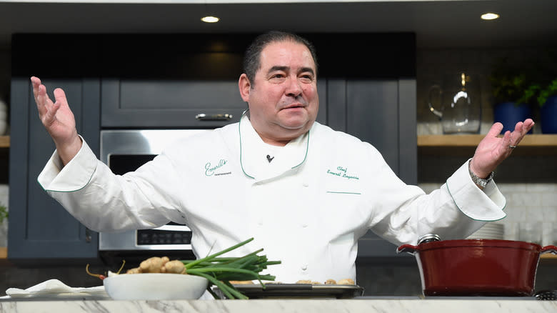 Emeril Lagasse with arms outstretched