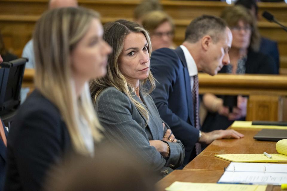 Karen Read sits with her legal team team in court Thursday, May 2, 2024, in Dedham, Mass. Read, 44, is accused of running into her Boston police officer boyfriend with her SUV in the middle of a nor'easter and leaving him for dead after a night of heavy drinking. (David McGlynn/New York Post via AP, Pool)