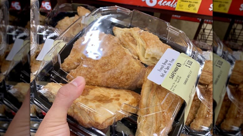 Man holding Safeway French bread