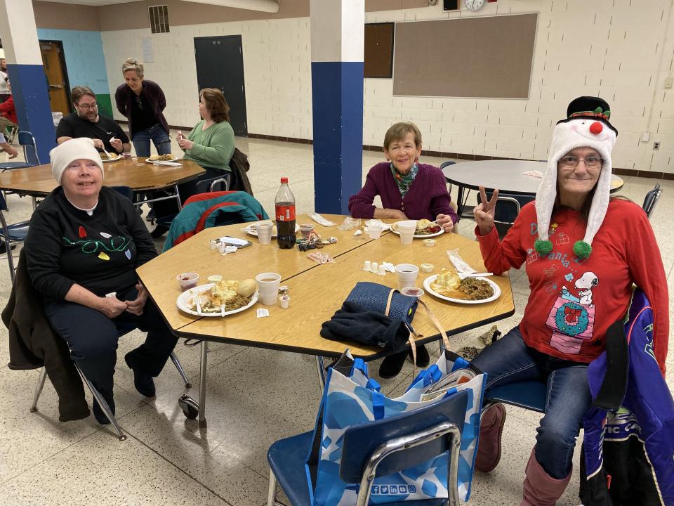 Sandy Bagnall, Carol Stewart and Cherryl Piercy, from left to right, enjoy each other's company and a Thanksgiving meal at Adrian Public Schools' Drager Early Education Center during the 2019 free community Thanksgiving dinner event put on by the Kiwanis Club of Adrian, Alpha Koney Island and Adrian Public Schools.