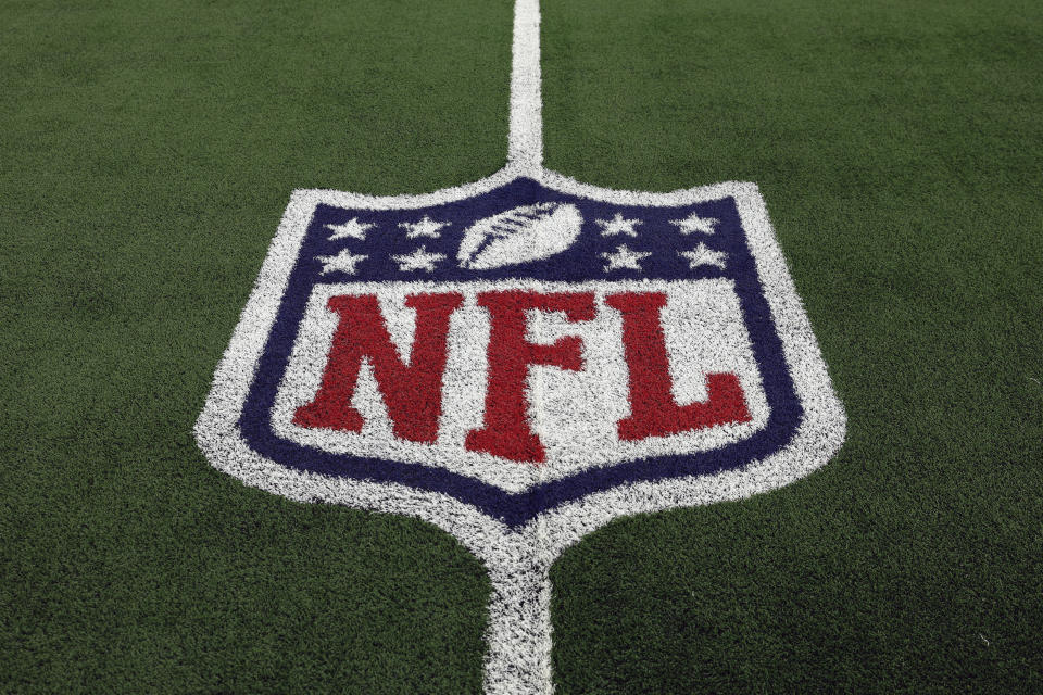FILE - The NFL logo is shown on the field before an NFL football game between the Detroit Lions and the Dallas Cowboys, Saturday, Dec. 30, 2023, in Arlington, Texas. NFL teams are set to dole up billions in free agent contracts in the coming weeks as teams around the league hope that bold moves in March will pay off with wins on the field once the season starts. But in a league with a sharp aging curve and specific systems that don’t suit all players those dollars spent don’t guarantee success. (AP Photo/Matt Patterson, File)