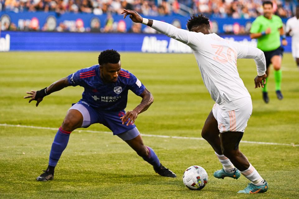 May 28, 2022; Montreal, Quebec, CAN; CF Montreal forward Romell Quioto (30) plays the ball against FC Cincinnati defender John Nelson (3) during the first half at Stade Saputo. Mandatory Credit: David Kirouac-USA TODAY Sports