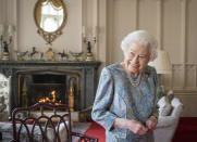 FILE - Britain's Queen Elizabeth II wears a paisley print dress while receiving the President of Switzerland Ignazio Cassis and his wife Paola Cassis during an audience at Windsor Castle in Windsor, England on April 28, 2022. (Dominic Lipinski/Pool Photo via AP, File)