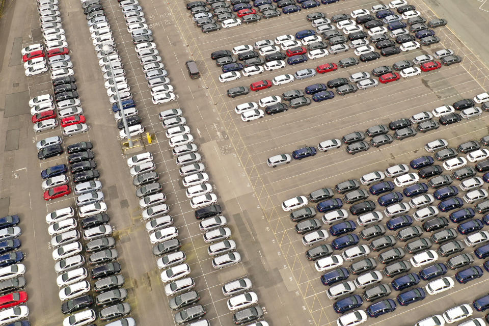 Recently assembled Vauxhall vehicles are stored in the distribution yard at the Vauxhall car factory on March 17, 2020 in Ellesmere Port, England. The carmaker's parent company, PSA Group, said its plants would remain closed through March 27, citing a drop in demand and supply-chain disruption due to the COVID-19 outbreak. (Photo by Christopher Furlong/Getty Images)