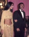<p>In a sparkling gold two-piece set and hoop earrings at the 45th Annual Academy Awards alongside Sonny Bono. </p>