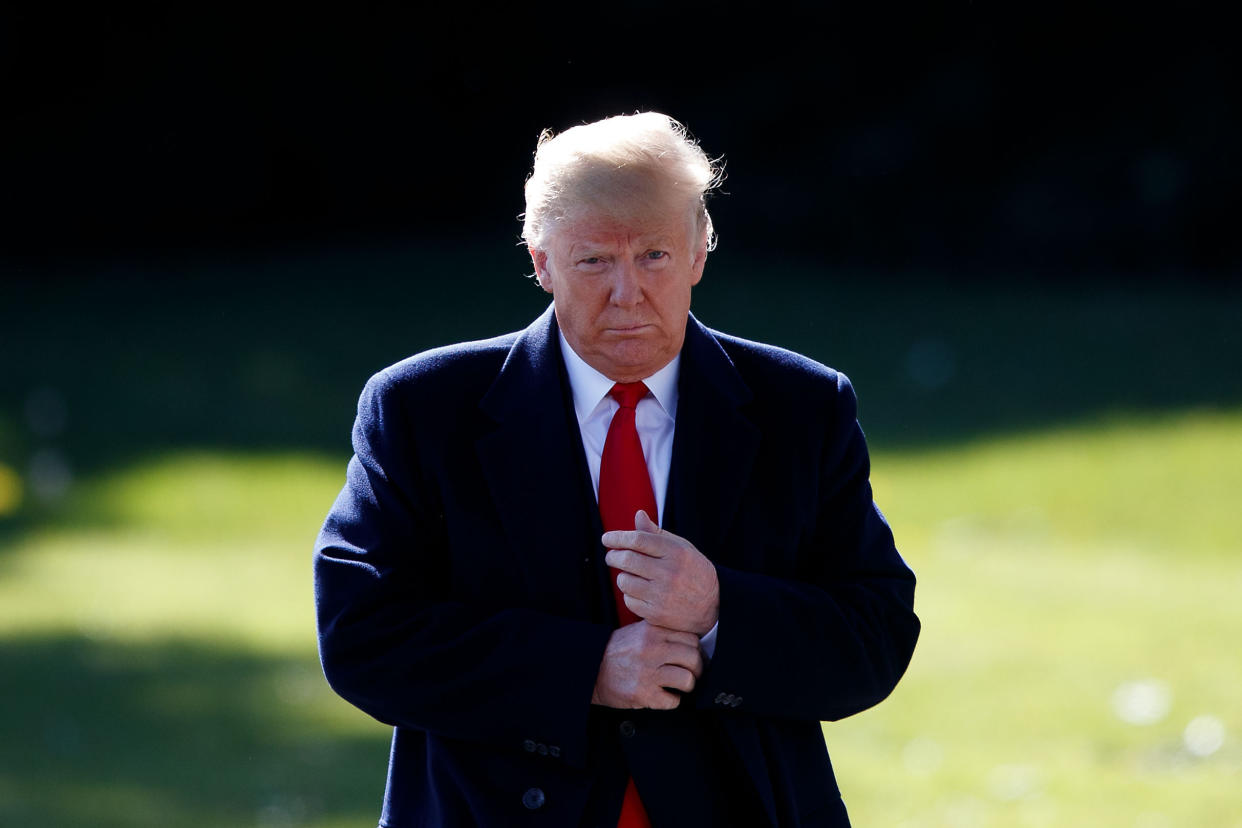 President Trump walks on the South Lawn before leaving the White House on Monday. (Photo: Xinhua/Ting Shen)