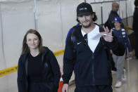 CORRECTS DATE - Los Angeles Dodgers outfielder James Outman, right, walks with his wife, Dasha Kraft, during the baseball team's arrival at Incheon International Airport, Friday, March 15, 2024, in Incheon, South Korea, ahead of the team's baseball series against the San Diego Padres. (AP Photo/Lee Jin-man)