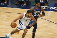 Memphis Grizzlies' Kyle Anderson (1) races to the basket with Minnesota Timberwolves' Josh Okogie (20) in pursuit in the first half of an NBA basketball game, Wednesday, Jan. 13, 2021, in Minneapolis. (AP Photo/Jim Mone)