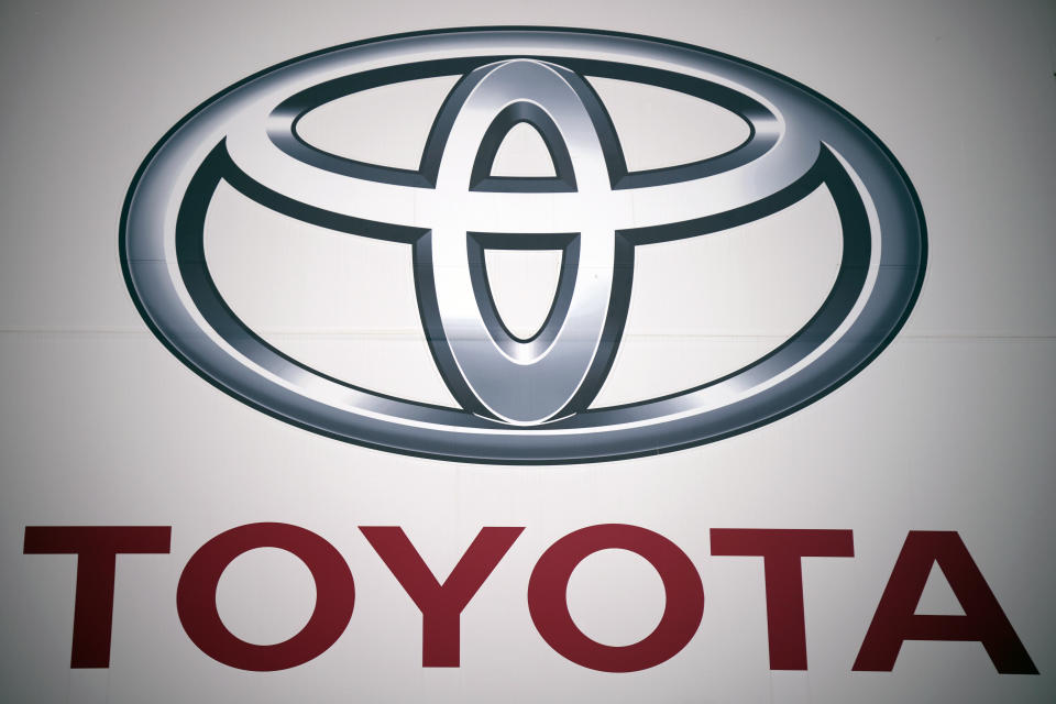 A logo of Toyota Motor Corp. is pictured at a dealer in Tokyo May 11, 2022. Toyota Motor Corp. reported Thursday, Aug. 4, 2022 a quarterly profit of 736.8 billion yen ($5.5 billion), down from 897.8 billion yen the previous year. (AP Photo/Eugene Hoshiko)