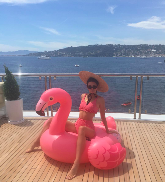 <p>Flamingo time! Kendall Jenner struck a pose in a pink ruffled bikini straddling a pink flamingo float. She finished her look with a straw hat and sunglasses and captioned the pic with a simple pink flower emoji. (Photo: Kendall Jenner via Instagram) </p>