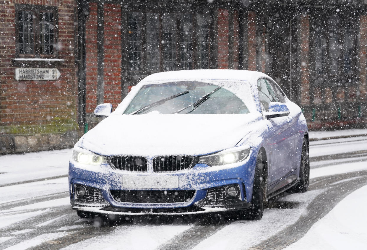 A car driving through a snow flurry in Lenham, Kent. Sleet and snow showers have been forecast for parts of the country on Monday as some regions are still trying to grapple with flooding following intense rainfall. Picture date: Monday January 8, 2024. (Photo by Gareth Fuller/PA Images via Getty Images)