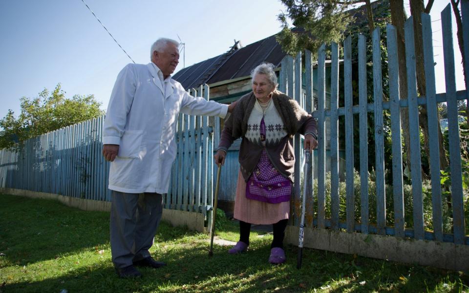 Dr Sokolov checks in on a 94-year-old woman in a nearby settlement - Andrey Borodulin 