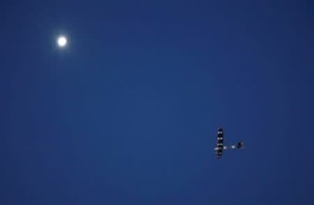 The solar-powered plane Solar Impulse 2, piloted by Swiss aviator Bertrand Piccard, is pictured before landing at San Pablo airport in Seville, southern Spain June 23, 2016. REUTERS/Marcelo del Pozo