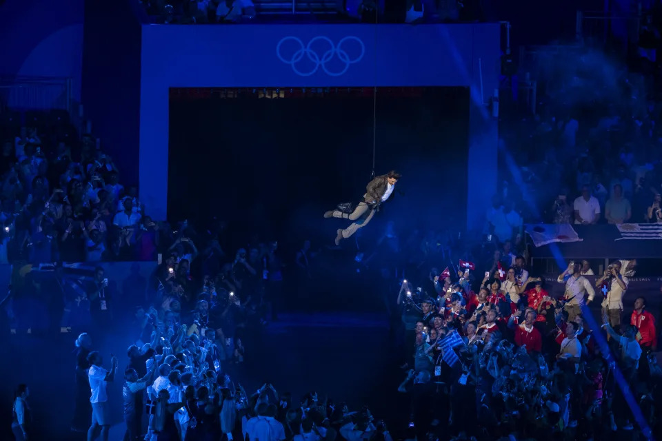  Tom Cruise rappels from the roof of the stadium during the closing ceremony.