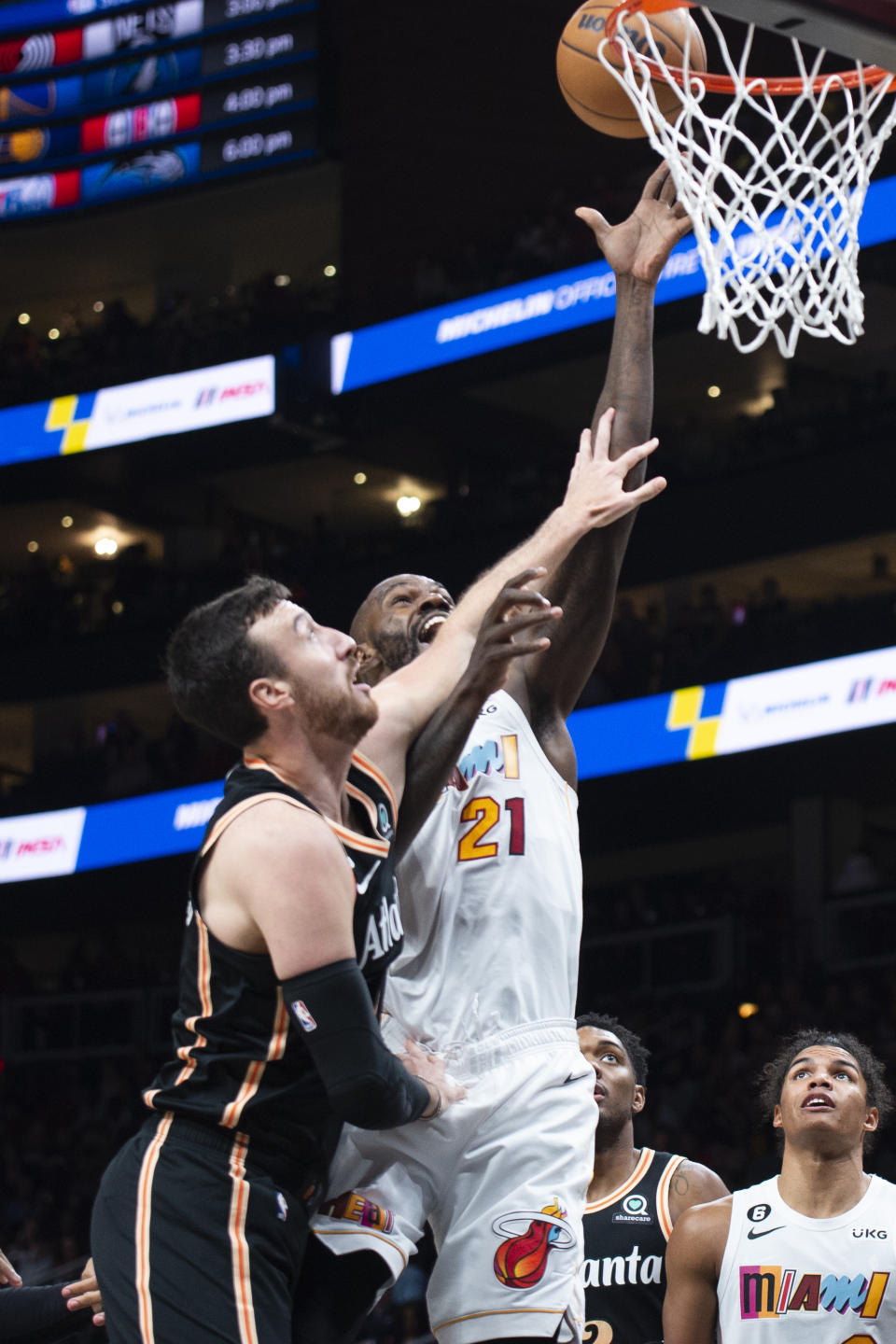 Miami Heat center Dewayne Dedmon is fouled by Atlanta Hawks forward Frank Kaminsky during the second half of an NBA basketball game, Sunday, Nov. 27, 2022, in Atlanta. (AP Photo/Hakim Wright Sr.)