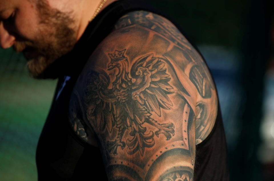 <p>Poland's hammer thrower Pawel Fajdek's tattoo, with the Polish emblem on his arm, is pictured during his training ahead of the Tokyo 2020 Olympics, at the stadium in Poznan, Poland June 28, 2021. Picture taken June 28, 2021. REUTERS/Kacper Pempel</p> 