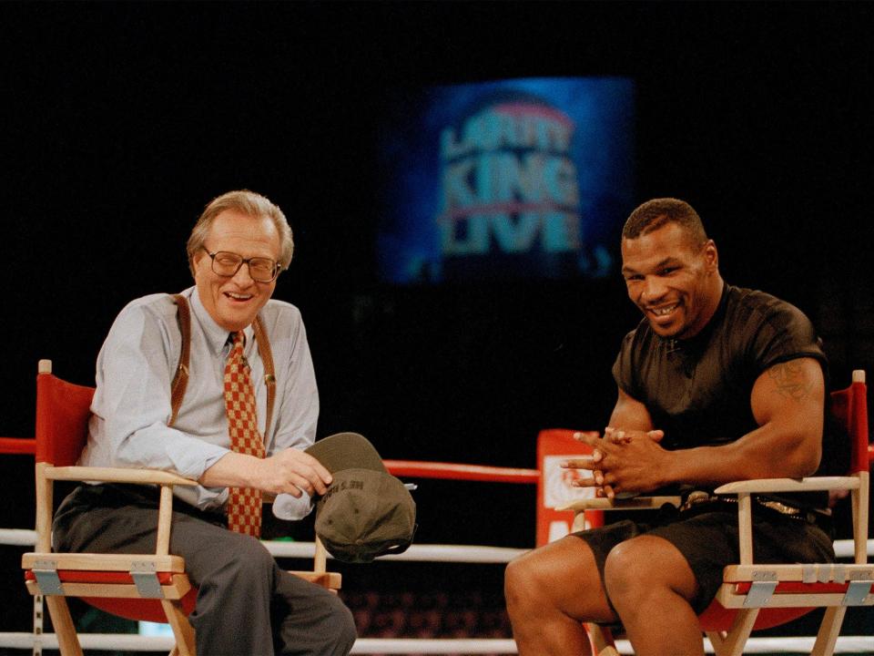 Heavyweights: Mike Tyson sharing a laugh with King in Las Vegas, 1995AP