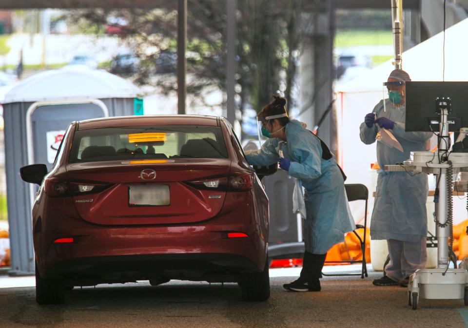 A drive-thru testing site is set up outside UC Health in Cincinnati, Friday, March 27, 2020.