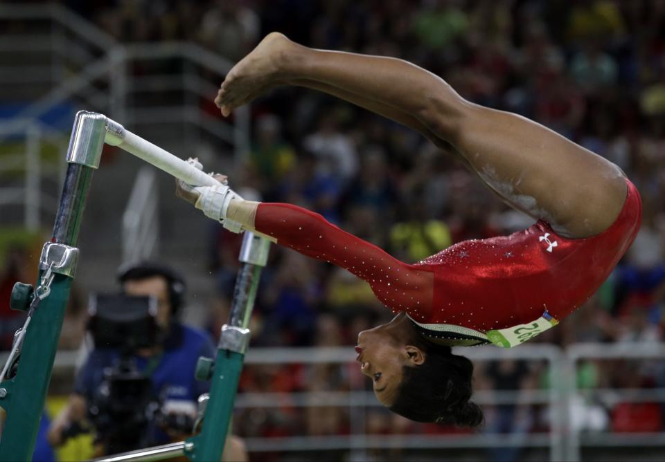 <p>United States’ Gabrielle Douglas performs on the uneven bars during the artistic gymnastics women’s apparatus final at the 2016 Summer Olympics in Rio de Janeiro, Brazil, Sunday, Aug. 14, 2016. (AP Photo/Rebecca Blackwell) </p>