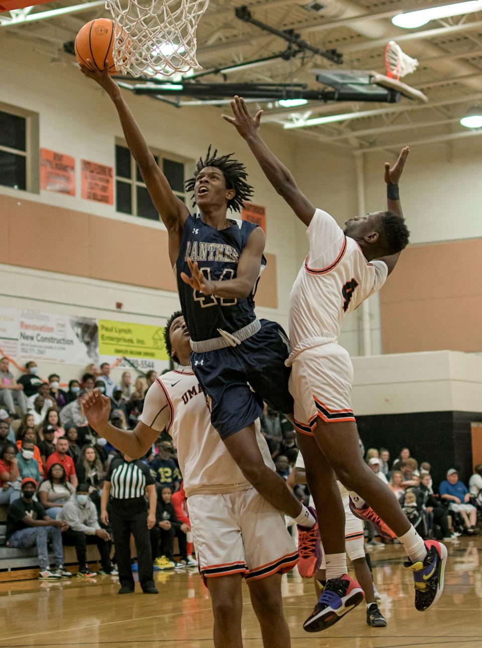 Eustis’ Naysean Rhome (44) scores two of his game-high 22 points Thursday against Umatilla at Umatilla.