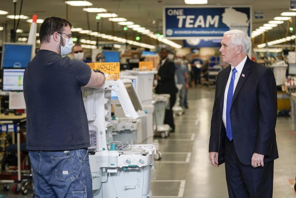 Vice President Mike Pence visits the GE Healthcare manufacturing facility Tuesday April 21, 2020, in Madison, Wis. (AP Photo/Morry Gash)