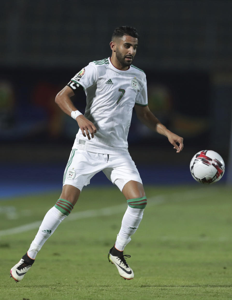 Algeria's Riyad Mahrez controls the ball during the African Cup of Nations round of 16 soccer match between Algeria and Guinea in 30 June stadium in Cairo, Egypt, Sunday, July 7, 2019. Algeria won 3-0. (AP Photo/Hassan Ammar)